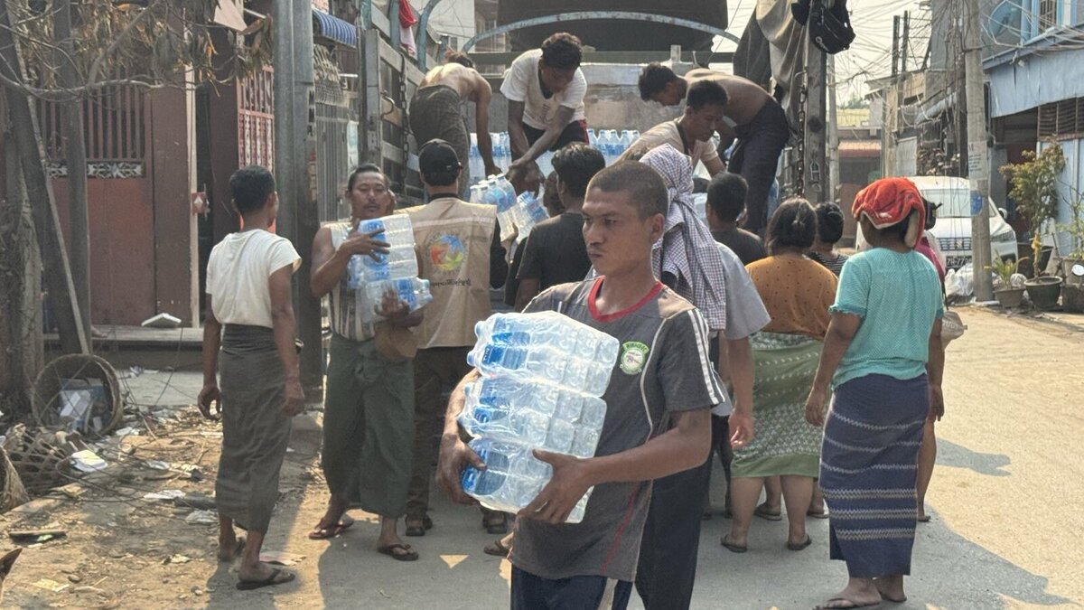 Drinking water packages are distributed from a truck