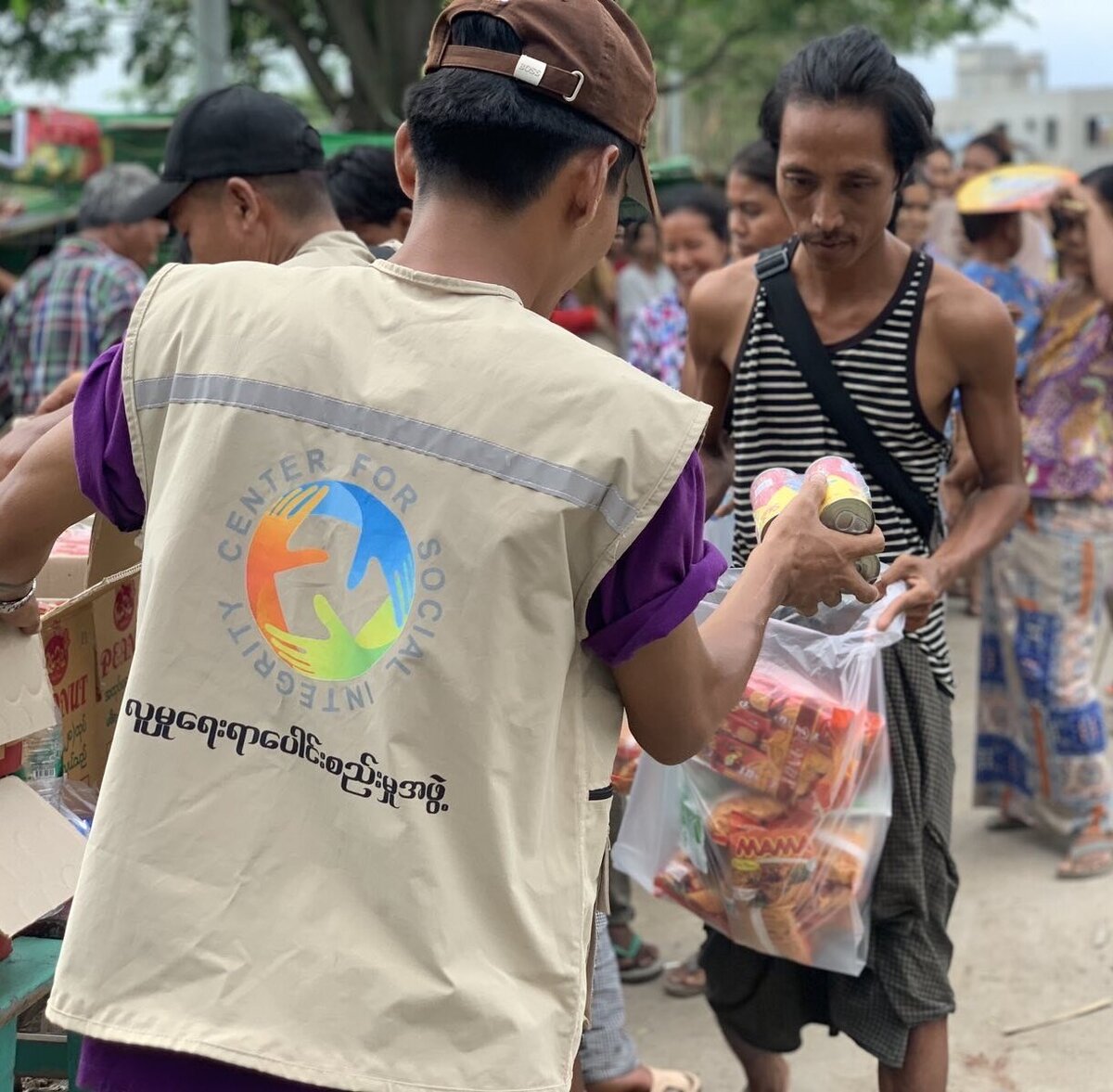 An aid worker distributes food