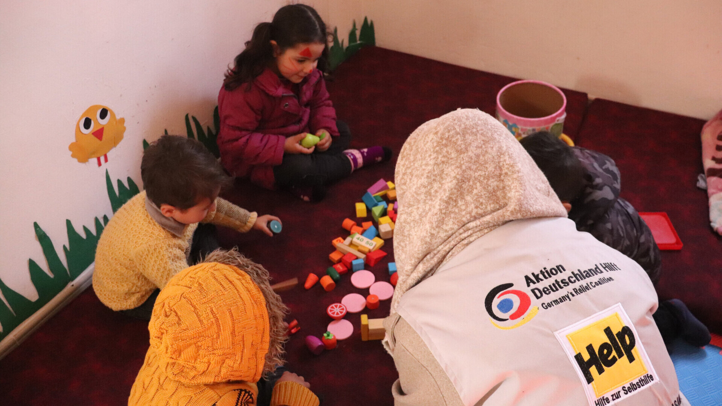 Syrian children play together in a safe space