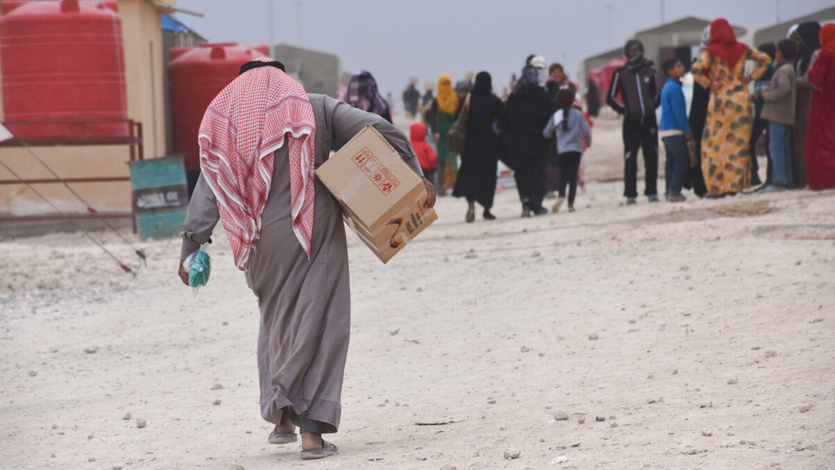 Development cooperation vs. humanitarian assistance Humanitarian assistance in a Syrian refugee camp